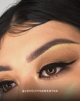 Extreme closeup shot of a woman's eye wearing Vasanti Felt Tip Liquid Eyeliner